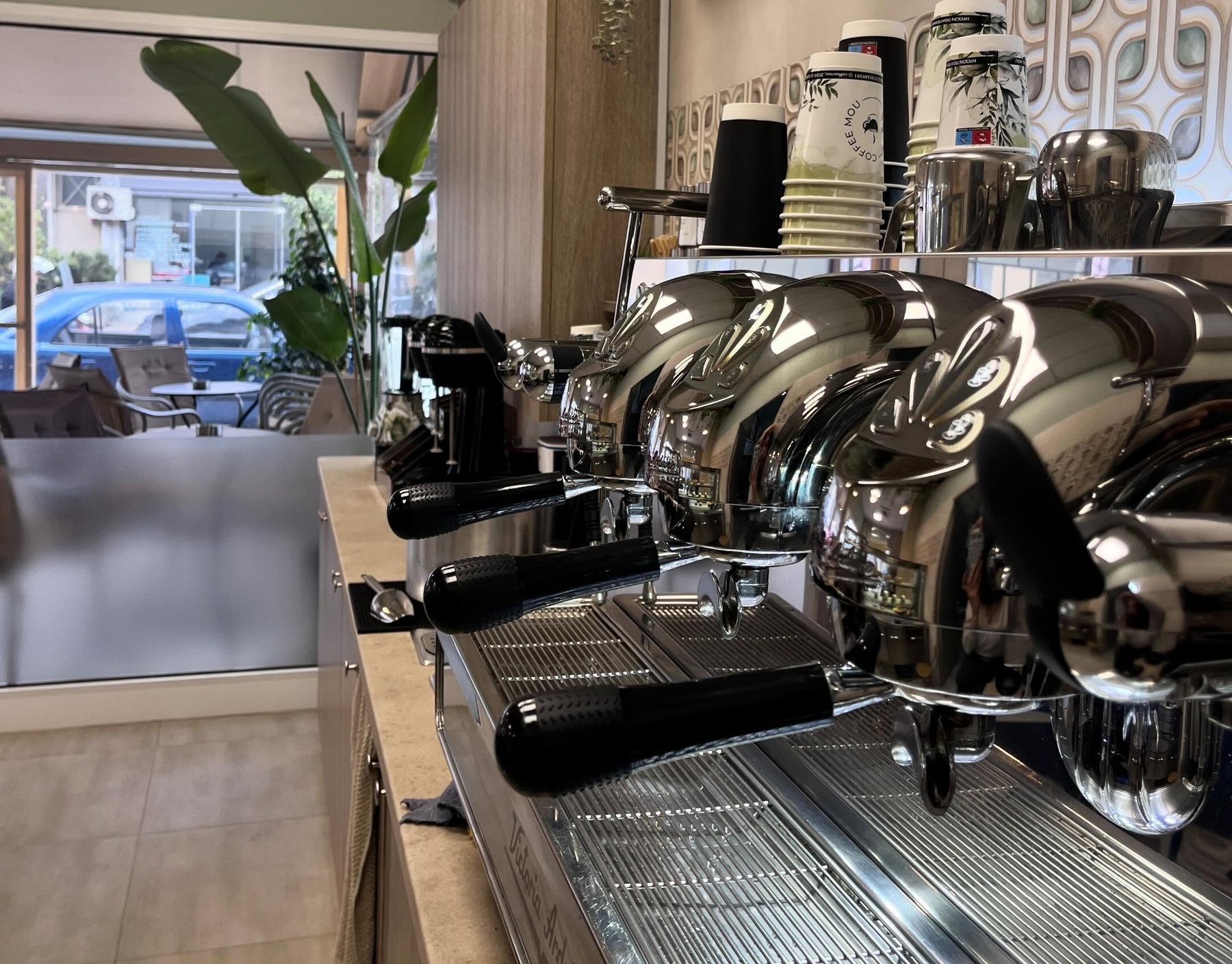 Coffee Mou: the espresso machine and our cups by the window
